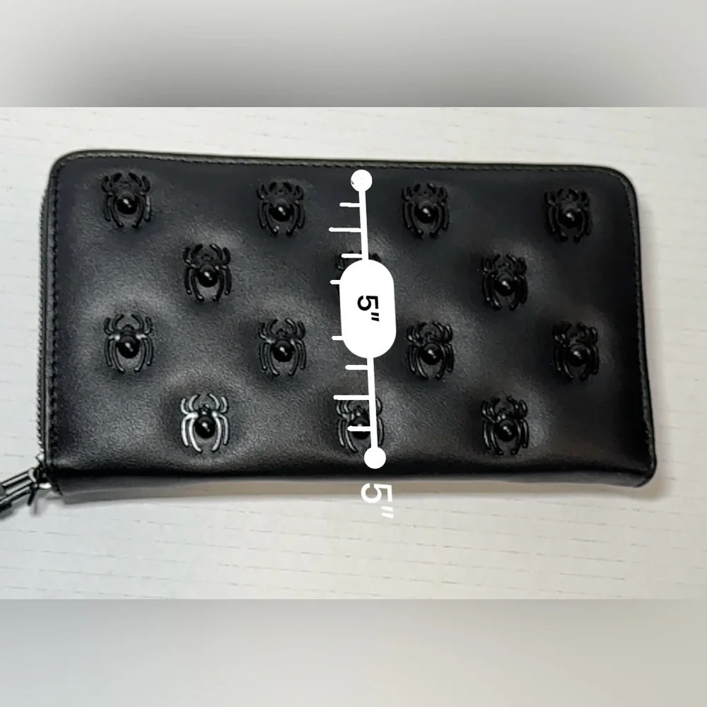 Betsey Johnson black faux leather zip-around wristlet/wallet